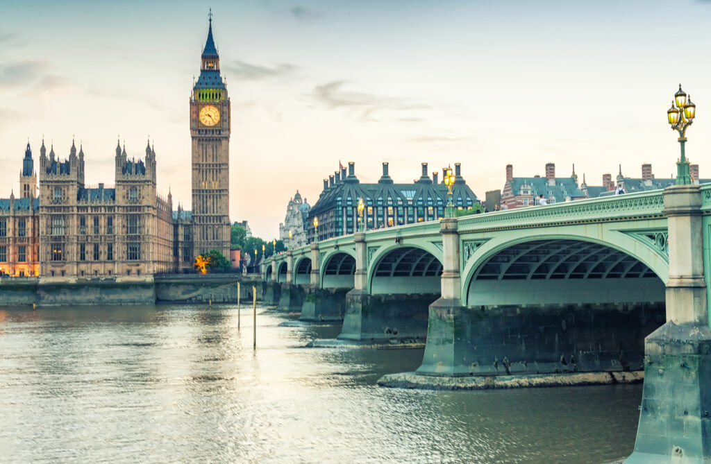 London Big Ben and Westminster Bridge with historic architecture and River Thames backdrop.