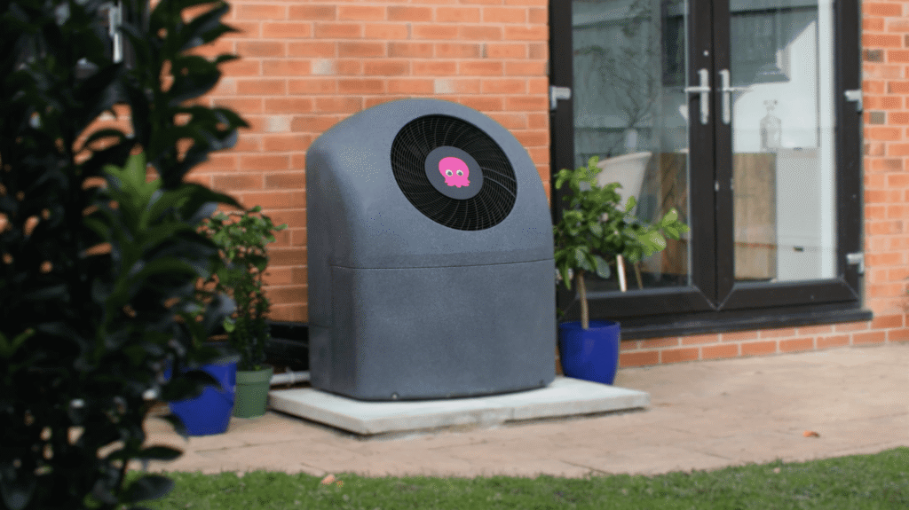 Modern solar-powered waste compactor outside Greener Energy Group building.