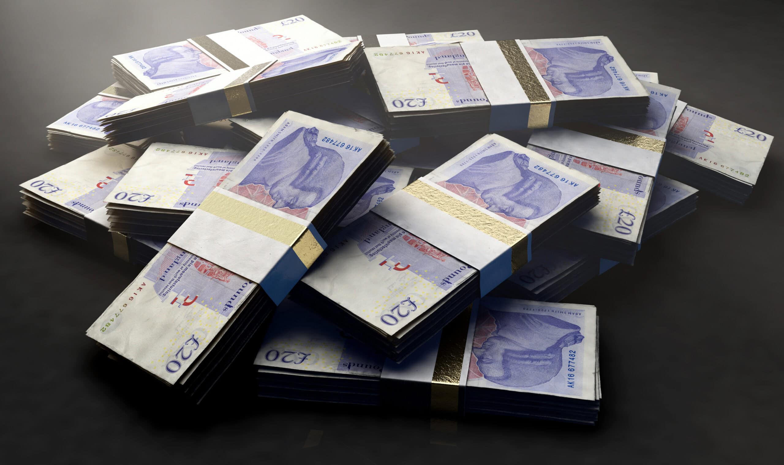 Stacks of £20 banknotes representing financial support for renewable energy projects.