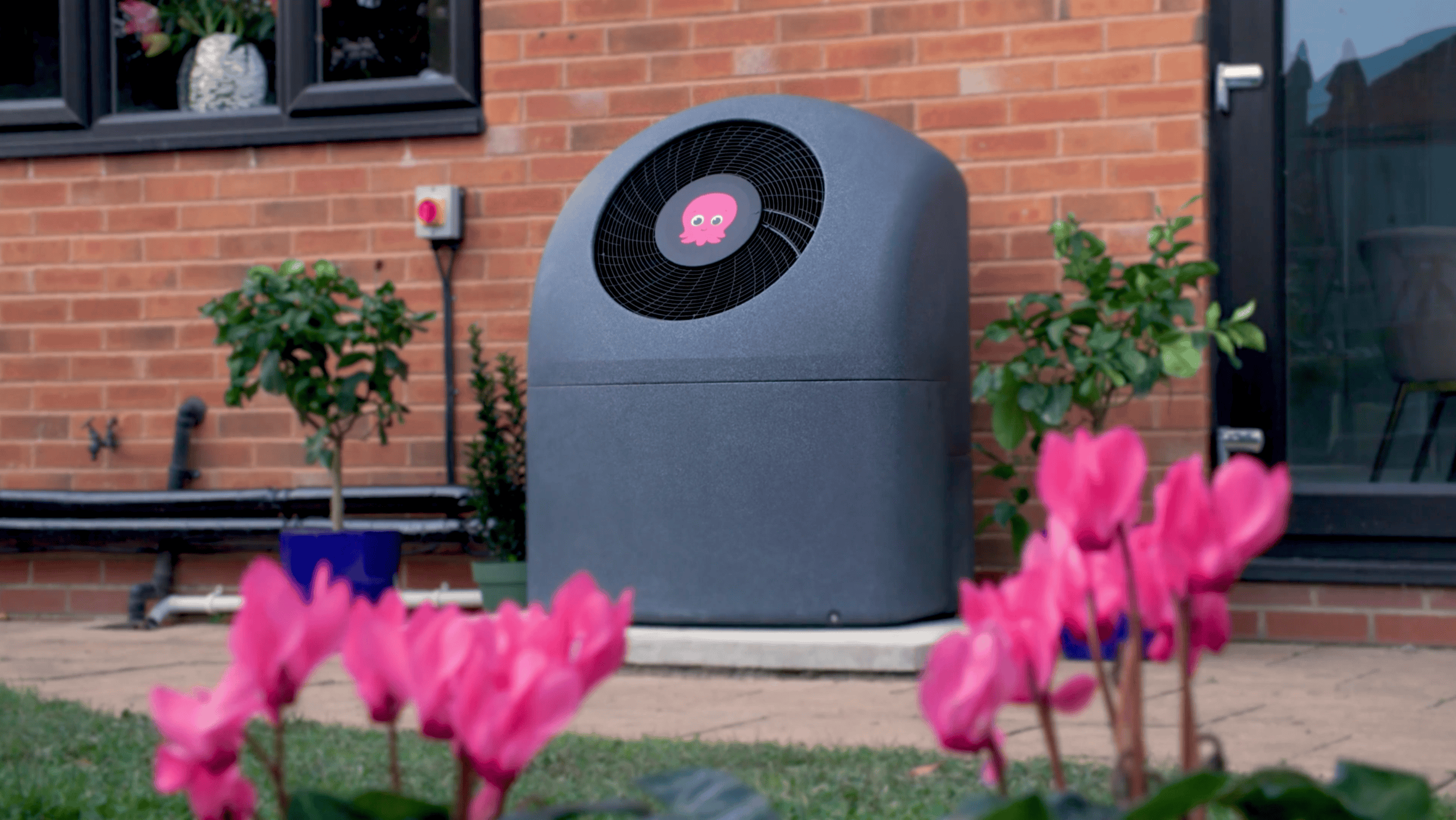 Octopus Cosy Heat Pumps 8 Efficient Octopus Cosy Heat Pump outside a home in the UK.
